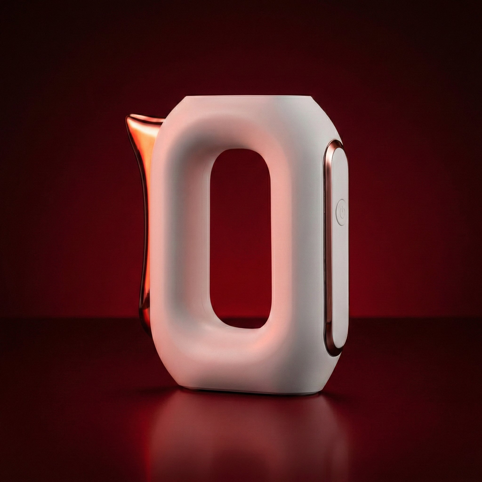 white guasha massager object on a dark background