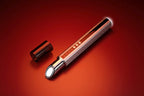 Cylindrical metallic object with a reflective surface on a red background